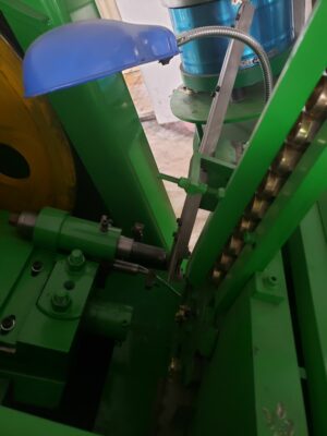 Welding nuts with flange trimming and ribs forming machine