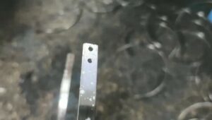 Earphone bracket flattening strip punching forming machine