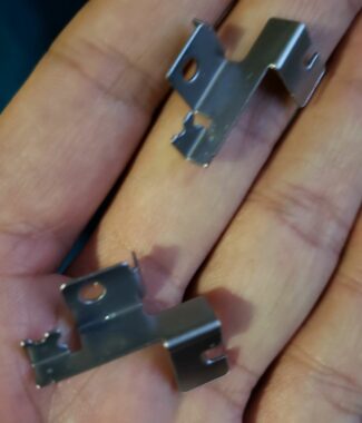 Multi angle bent clip progressive stamping press with dice