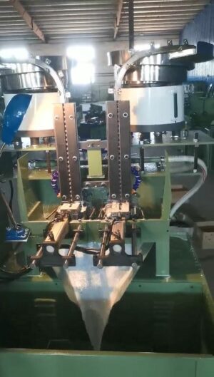 Two stations vibrator feeding nut thread tapping machine