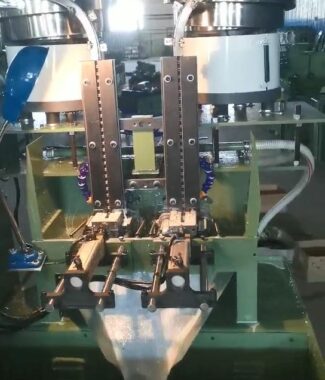 Two stations vibrator feeding nut thread tapping machine